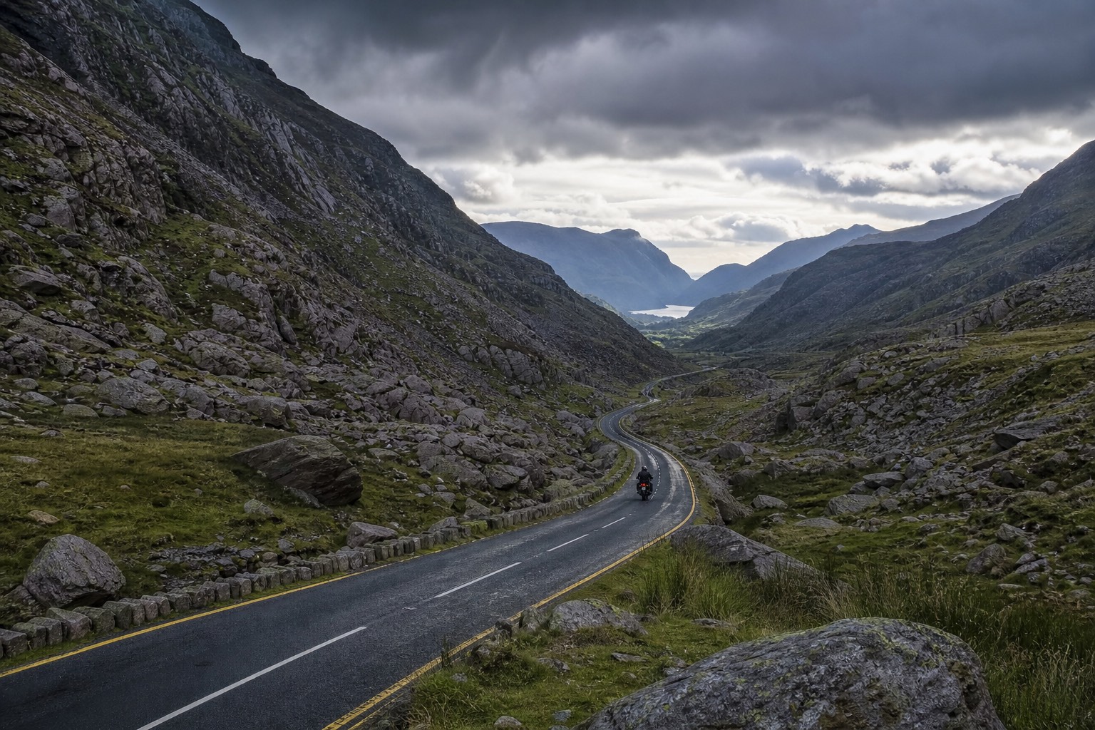 Road winding through the rugged Llanberis Pass in Snowdonia